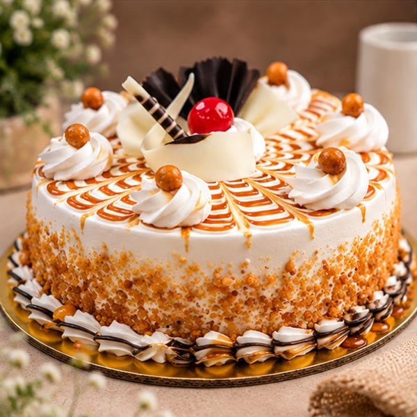 Delightful Caramel Butterscotch Cake with Cream & Chocolate Garnish 3